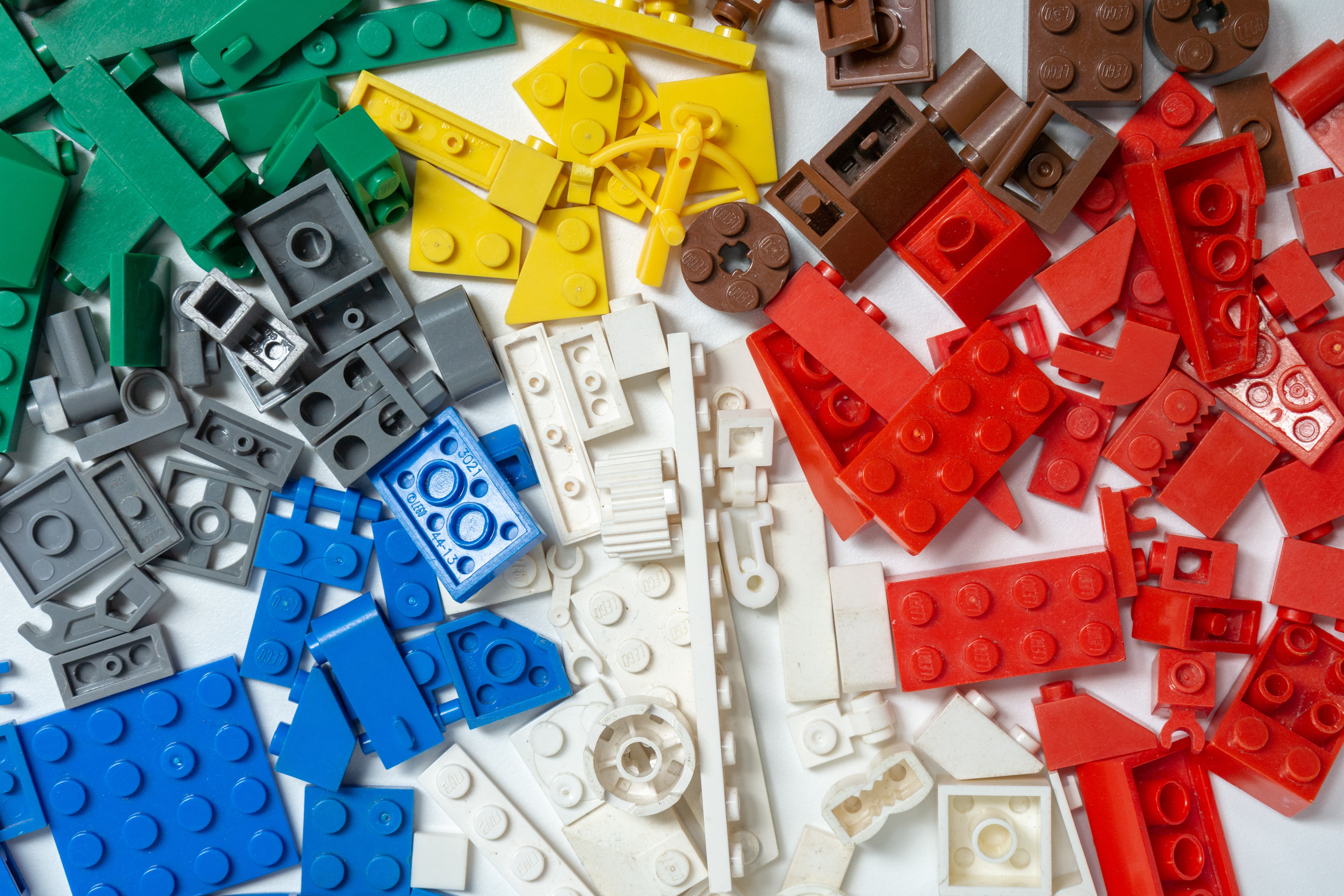 Lego block, sorted by color, on a table